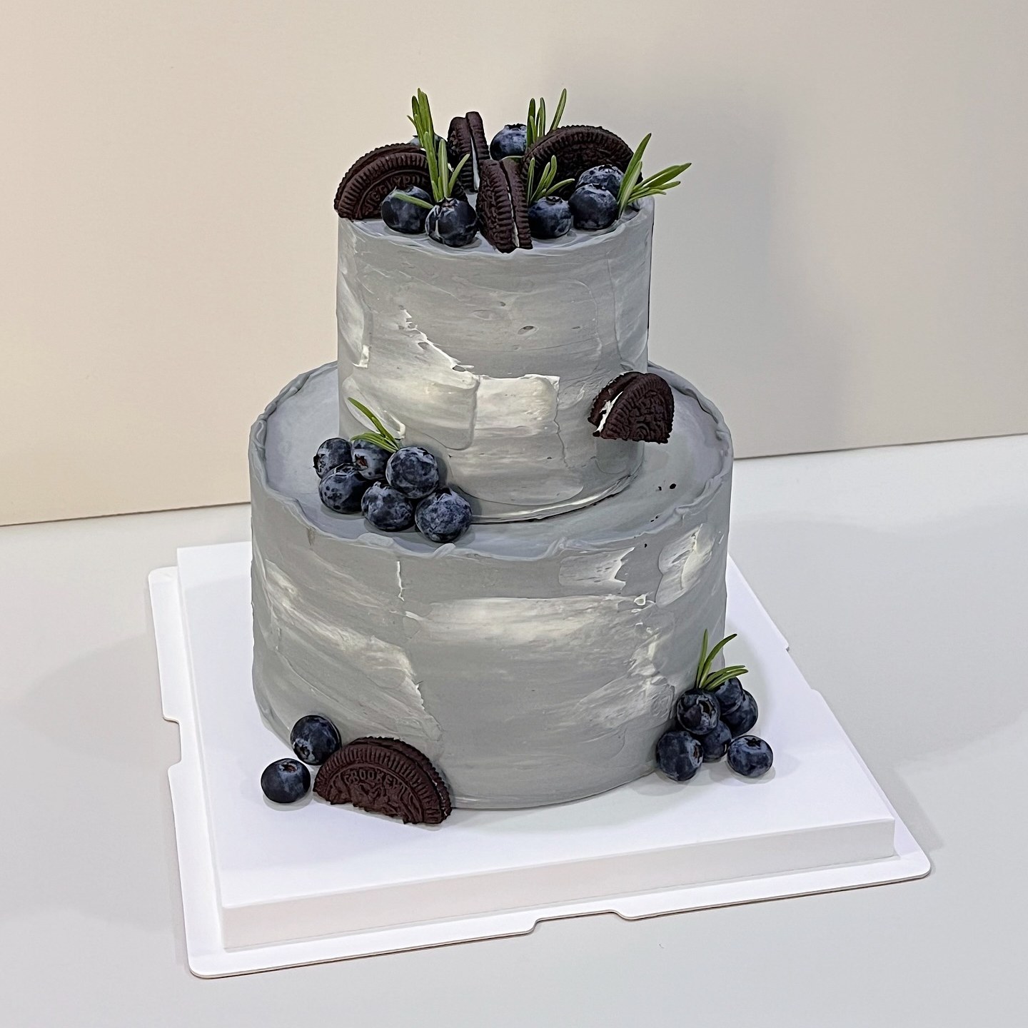 Minimalist flat-lay illustrated cake with pastel piping details