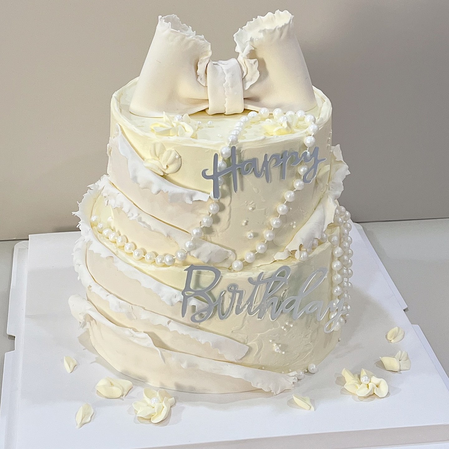 Minimalist flat-lay illustrated cake with balloons and a birthday message